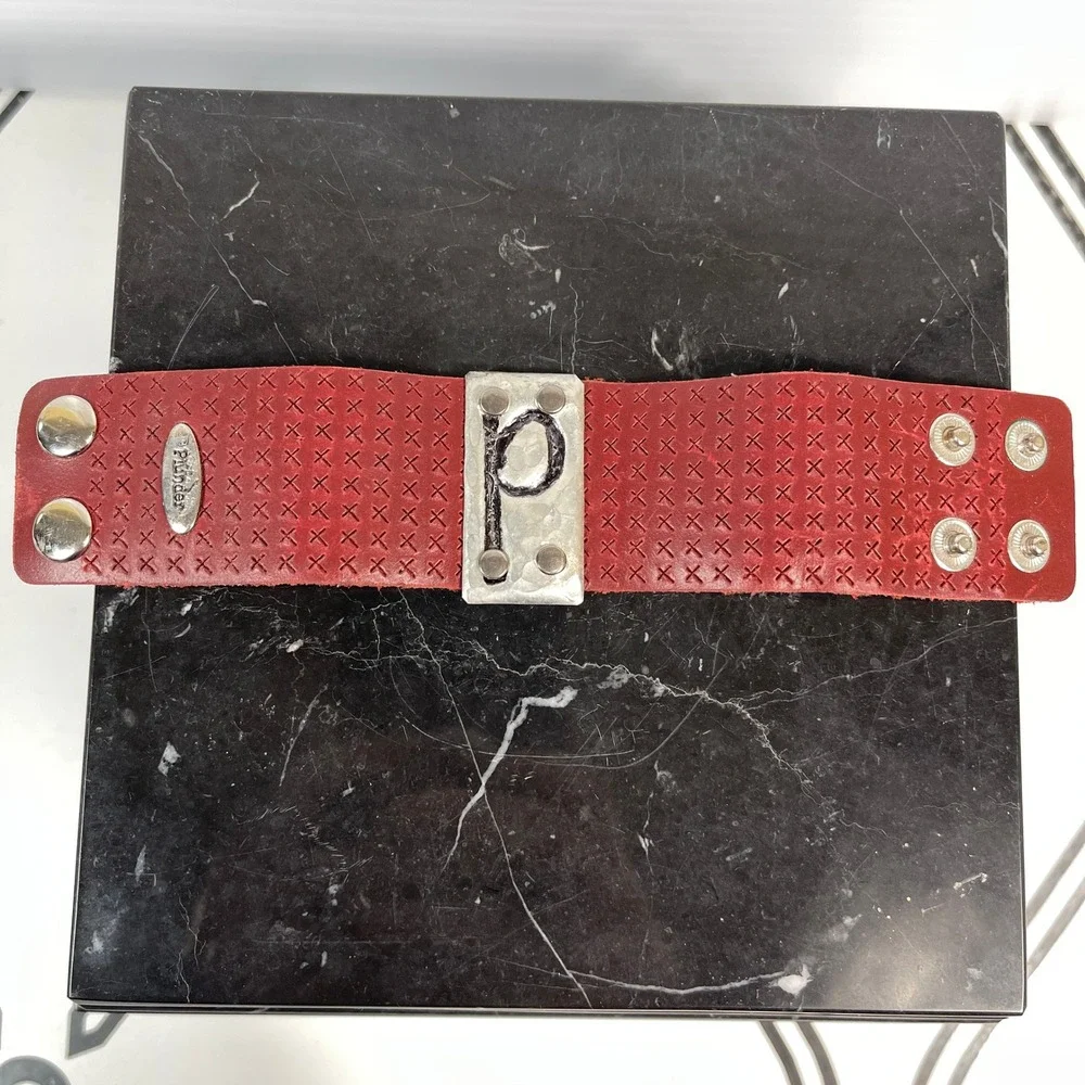 Plunder Red Leather Cuff Bracelet with P‎ Initial Metal Accent Snap Closure